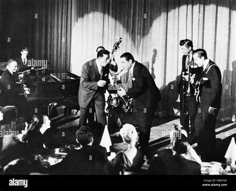 HEY BOY! HEY GIRL!, Louis Prima (standing center), Sam Butera (with saxophone) and the Witnesses ...