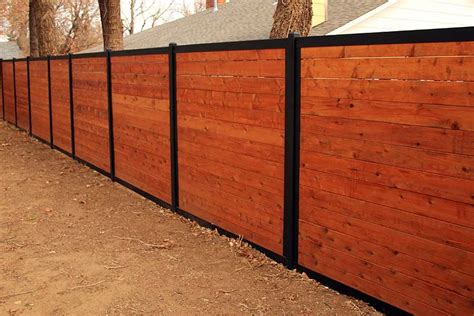 Build a Wood Fence With Metal Posts (That's Actually Beautiful) | Fence design, Wood privacy ...