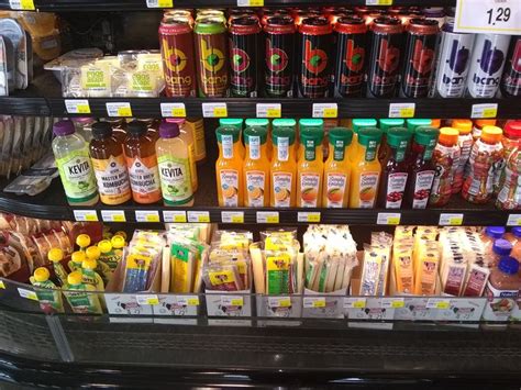 a display in a store filled with lots of juice