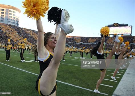 High kick! | Iowa hawkeyes cheerleaders, Cheer athletics, Cute cheerleaders