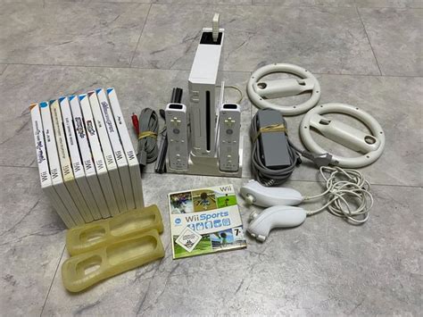 Nintendo Wii +accessories and 10 videogames. - Console - Catawiki