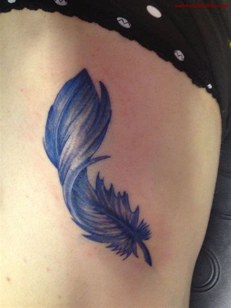 Dark Blue Ink Tattoo Dark blue tattoo ink | Feather tattoo design, Blue feather tattoo, Feather ...