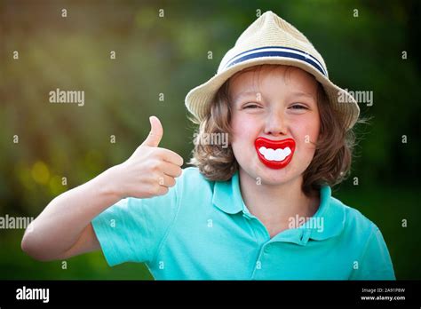 Boy with funny big teeth pacifier Stock Photo - Alamy