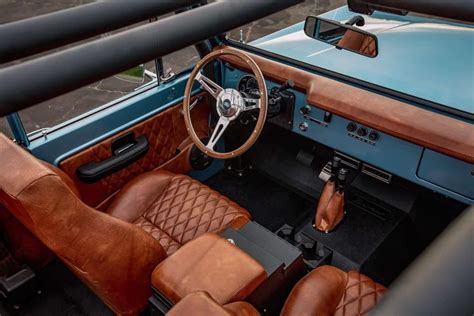 the interior of an old car with leather seats