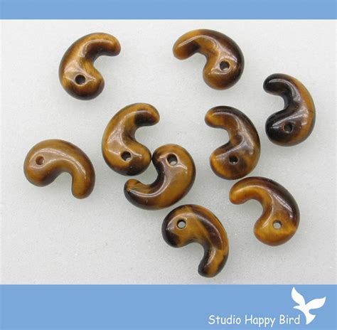 Magatama beads also have a liquid-like shape, but they are slightly ...