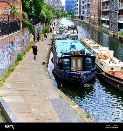 Canal pathway with people walking in Camden Town London Stock Photo - Alamy