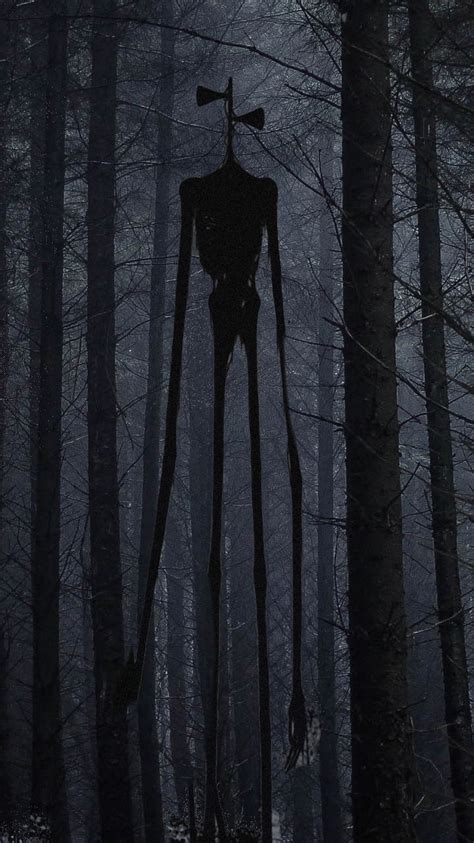 a creepy figure standing in the middle of a forest