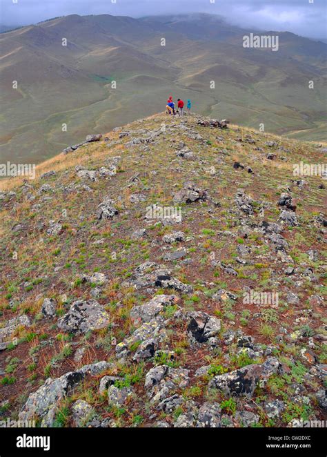 4 geologists collecting rock samples, Otgon Tenger Mountains, western Mongolia Stock Photo - Alamy