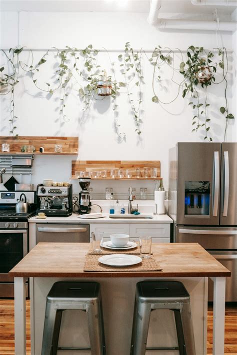 Kitchen and dining area in Scandinavian style located in cozy apartment · Free Stock Photo