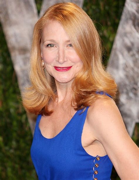 a woman in a blue dress posing for the camera