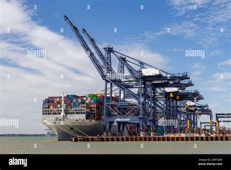 Giant container ship (the OOCL INDONESIA) in Felixstowe Docks viewed from Landguard Point ...