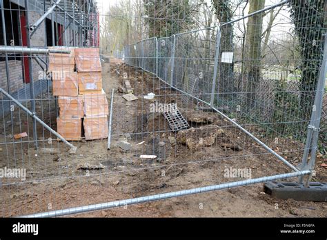 Security fencing on a British Construction site Stock Photo - Alamy