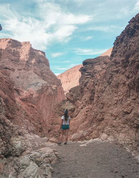 Standing on a cliff edge on Natural Bridge trail • Reckless Roaming