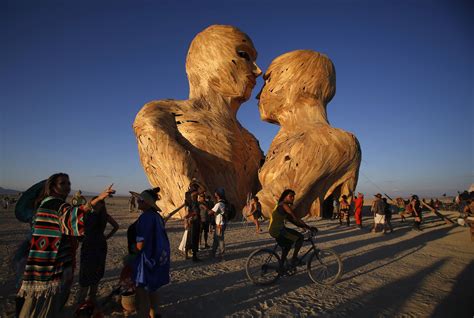 People gather around the art installation Embrace during the Burning ...