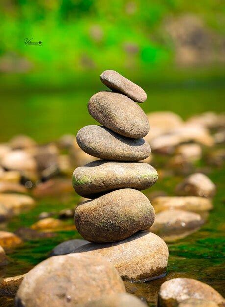 Premium Photo | A picture of a stack of rocks with the word zen on it