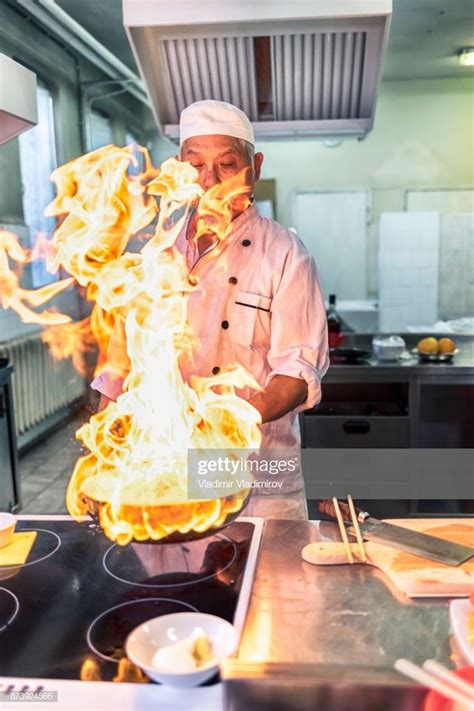 Chef cooking in asian restaurant. | Chinese restaurant, Chef, Restaurant photography