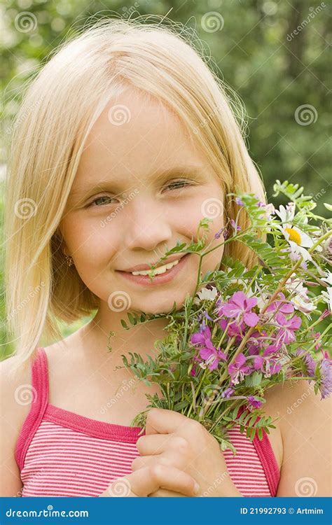 Smiling girl with flowers stock image. Image of freedom - 21992793