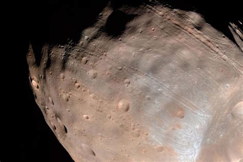 Giant grooves on Mars’s moon Phobos may be caused by rolling boulders ...