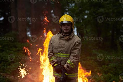 Firefighter in action 11620604 Stock Photo at Vecteezy