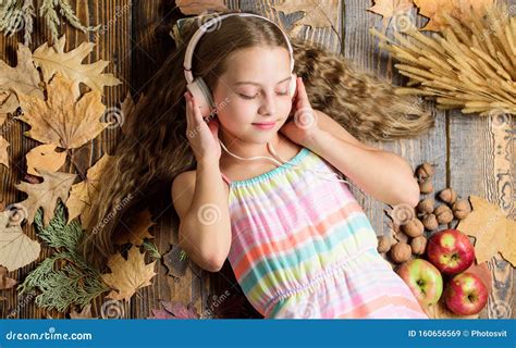 Relaxing Music for Kids. Cute Child Enjoy Music Playing in Earphones. Small Girl Wearing Stereo ...