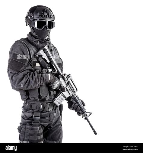 Spec ops police officer SWAT in black uniform and face mask Stock Photo ...