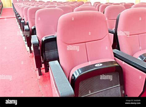 Empty movie theater with red seats Stock Photo - Alamy