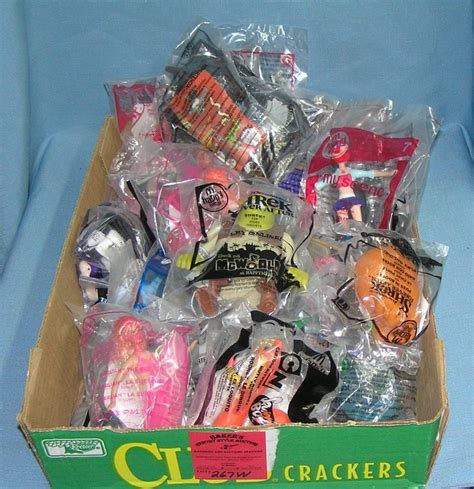 BOX FULL OF VINTAGE FAST FOOD COLLECTIBLE TOYS