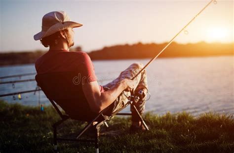 Men Fishing in Sunset and Relaxing while Enjoying Hobby Stock Image - Image of freshwater, pond ...