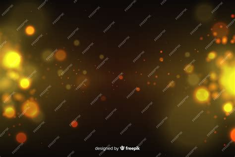 Free Vector | Golden particles background in bokeh style