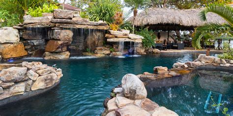 Custom Rock Waterfall Pool Grotto, Spa, Natural Stream, Tiki Hut