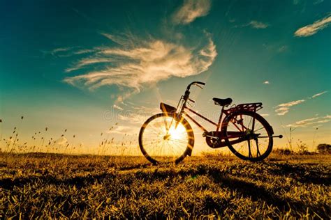 Bicycle at the Sunset or Sunrise Stock Image - Image of morning, relax ...