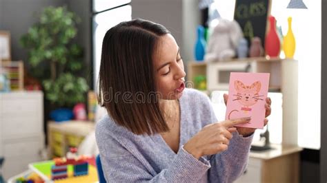 Young Beautiful Hispanic Woman Preschool Teacher Teaching Words at Kindergarten Stock Image ...