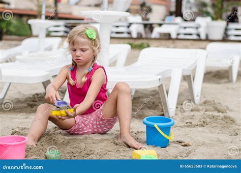 Kid playing in sand stock image. Image of holiday, sand - 65623603