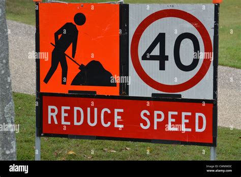 Construction ahead, reduce speed to 40kmph sign Stock Photo - Alamy