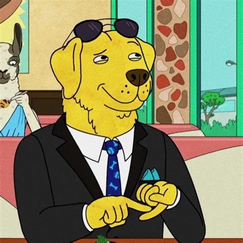 a yellow dog in a suit and sunglasses sitting at a table next to another dog