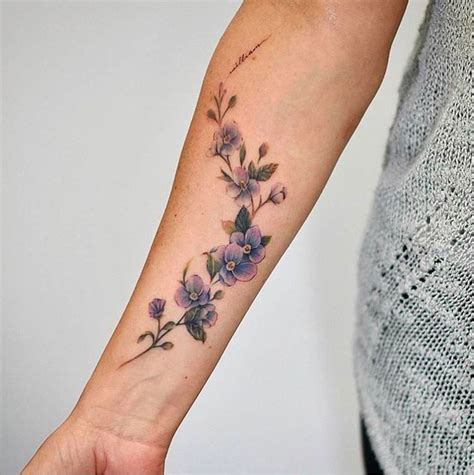 20 Beautiful Wrist Tattoo Ideas | Flower wrist tattoos, Vine tattoos, Purple flower tattoos