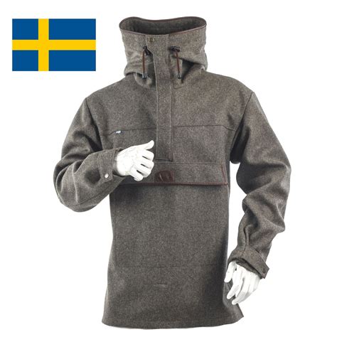 a man wearing a coat with the flag of sweden on it