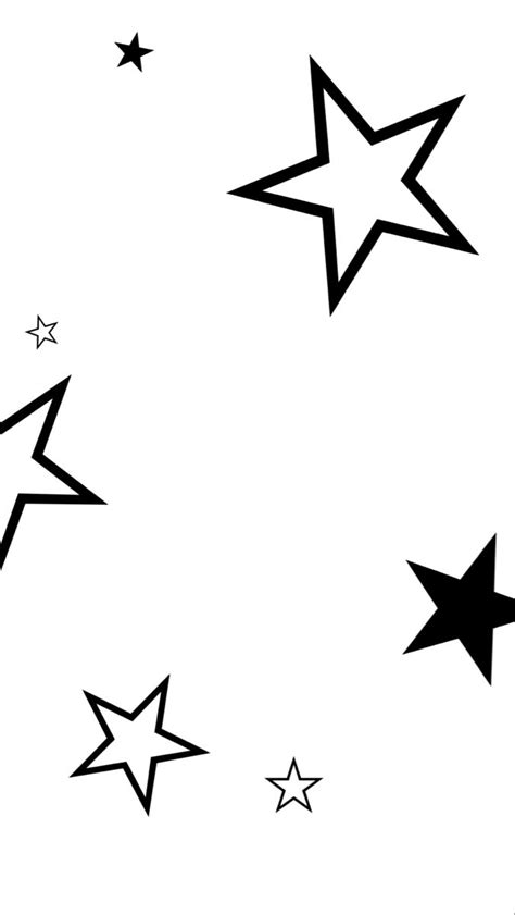 black and white stars are flying in the air with one star at the top right
