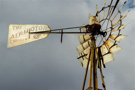 Golden Sun shines on the blades of an Aermotor Windmill