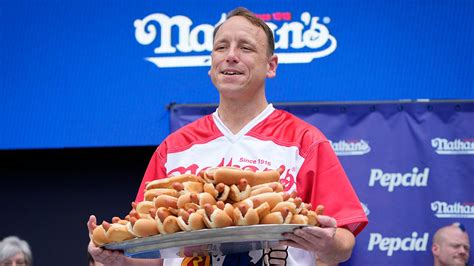 Joey Chestnut wins men's hot dog eating contest after weather delay ...