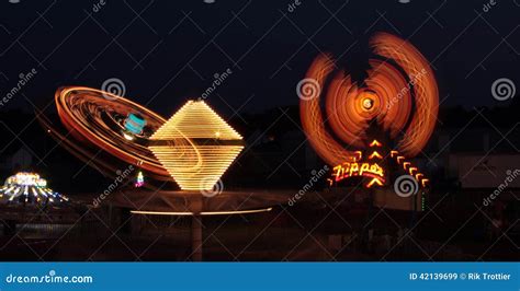 Fair rides at night stock image. Image of light, spin - 42139699