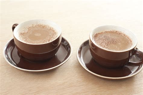 Two cups of fresh cappuccino coffee - Free Stock Image