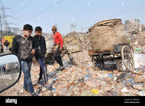 New Delhi, India. 10th Feb, 2022. People searching for recoverable ...