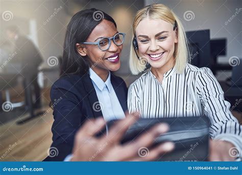 Two Smiling Young Businesswomen Taking Selfies Together in an of Stock Image - Image of finance ...