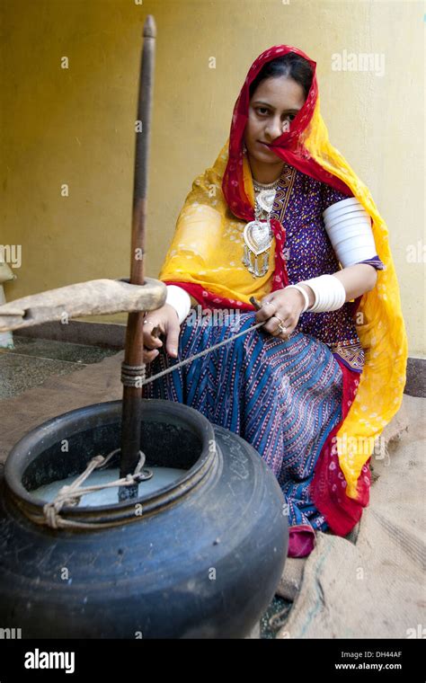 Indian Rajasthani village woman churning butter milk rajasthan India ...