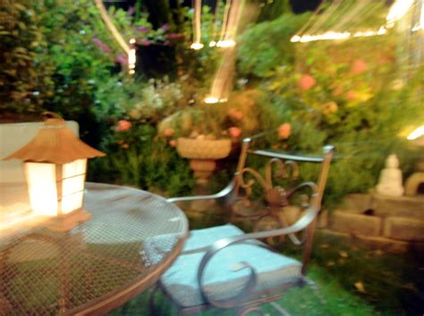Lights, patio table, flowers, lamp, chair, night, A Garden… | Flickr