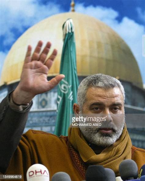 Hamas' Ismail Haniya salutes following his press conference in Gaza ...