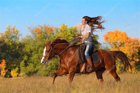 Beautiful Smiling Girl Riding Horse On Autumn Field