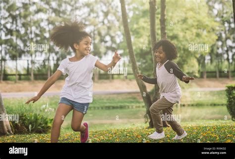 Kids playing with friends. Children Running At Park Stock Photo - Alamy