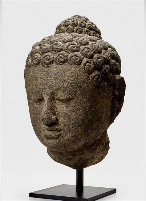 AN ANDESITE HEAD OF BUDDHA INDONESIA, CENTRAL JAVA, 9TH CENTURY 35.6 cm (14 in.) high | Buddha ...